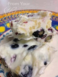 two pieces of blueberry cheesecake on a plate