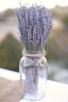 lavender flowers in a mason jar on a table