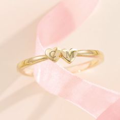 Made of solid 14k gold (not plated, not filled, not vermeil), this ring is available in your choice of yellow, white, or rose gold (as well as platinum upon request) This listing is for a two heart ring but this style is available with one, two, three, four, and five hearts. If you would like a different number of hearts for your ring, please message me for a custom listing. Pricing may vary. Personalize this ring by adding a custom engraving with the initials of your most cherished loved ones - message directly for details! Show your love and gift this sentimental piece to someone special - this ring is delivered in a beautiful gift box ready for gifting Metal: 14K Solid Gold Solid/Hollow: Solid Shank Width: 1.7mm Made-to-order, this item typically ships within 1-10 business days. However Rose Gold Hallmarked Initial Ring For Gift, Yellow Gold Jewelry For Valentine's Day, Gold Heart Ring For Promise With Round Band, Gold Heart Ring For Promise, 14k Gold Stackable Rings With Initials For Anniversary, Gold Stackable Heart Promise Ring, Personalized 14k Gold Silver Heart Ring, Gold Stackable Heart Ring Promise, Personalized Silver Heart Ring In 14k Gold