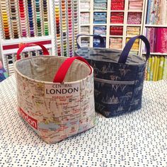 two bags sitting next to each other on a table