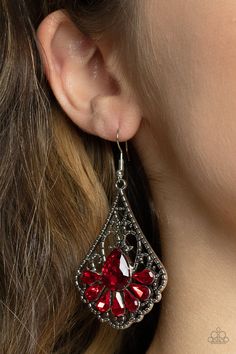 Exemplary Elegance Red Earring - Paparazzi Accessories  A sparkly collection of fiery red teardrop rhinestones fan out across the bottom of a textured filigree filled teardrop frame, creating an elegant centerpiece. Earring attaches to a standard fishhook fitting.  Featured inside The Preview at GLOW!  Sold as one pair of earrings.