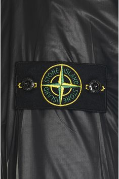 Self & Lining: 100% polyamide, Fill: 100% polyester.  Made in Vietnam.  Machine wash.  Front zipper closure.  3-pocket design.  Stand up collar.  Stone Island Compass logo patch at arm.  Lightweight padded ripstop fabric.  .  .  .  .  .  .  .  . Stone Island Jacket, Compass Logo, Design Stand, Packable Jacket, Stand Up Collar, Ripstop Fabric, Trucker Jacket, Corduroy Jacket, Stone Island