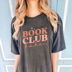 Indulge in the world of books and literature with the Comfort Colors Book Club Babe Shirt. This tee celebrates the love for reading and book clubs, making it a perfect choice for bookworms and reading enthusiasts. With its literary fashion and comfortable fit, it's an ideal apparel piece for showcasing your passion for literature and connecting with fellow book lovers. All clothing and accessories from The Southern Thistle are handmade-to-order, just for you! ☺️ Experience the epitome of comfort Book Club Shirt Ideas, Book Club Sweatshirt, Book Club Shirts, Babe Shirt, Book Clubs, Club Sweatshirts, Gifts For Bookworms