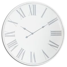 a white clock with roman numerals on the face