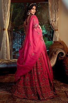 Red, maroon and fuchsia attached cancan lehenga with all over floral hand embroidery. Paired with a padded blouse with flower embroidery and dupatta. - Aza Fashions Red Raw Silk Choli With Mirror Work, Red Chanderi Gown With Traditional Drape, Red Raw Silk Traditional Wear With Mirror Work, Red Chanderi Gown With Cutdana, Red Chanderi Gown With Cutdana Details, Red Navratri Gown With Mirror Work, Red Cutdana Chanderi Gown, Red Gown With Mirror Work For Navratri, Red Lehenga With Mirror Work And Traditional Drape