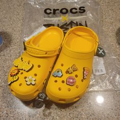 Crocs X Justin Bieber Drew House Yellow Classic Clogs Women's Size 9 Nwt Yellow Synthetic Mules With Round Toe, Yellow Synthetic Clogs With Rubber Sole, Yellow Flat Casual Mules, Yellow Synthetic Clogs With Round Toe, Yellow Closed Toe Synthetic Clogs, Yellow Synthetic Closed Toe Clogs, Yellow Crocs, Drew House, Shoes Crocs