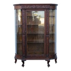 an old wooden display case with glass doors