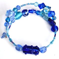 a blue beaded bracelet with glass beads