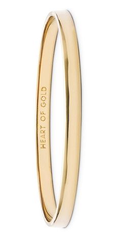 This slim, stackable Kate Spade bangle plated in lustrous 12-karat gold hides a meaningful "heart of gold" engraving inside. Staple Jewelry, Diamond Carat Size, Shiny Bracelets, Kate Spade Bangle, The Bling Ring, Diamond Bracelet Design, Stackable Bangles, Jewelry Staples, Classic Bracelets