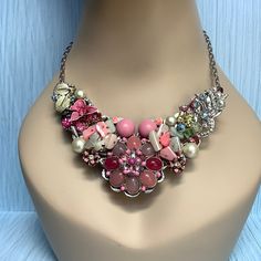 "A new silver toned bib necklace base adorned with pink silver and crystal vintage brooches and earrings.  17\" long.  Let me know if you want an extender added." Jewelry Repurposed, Handmade Bib, Assemblage Necklace, Stylish Necklace, Bib Necklaces, Pink Necklace, Upcycled Jewelry, Pink Vintage, Metal Flowers