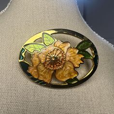 Gorgeous Vintage Enamel Flower Pin Brooch Brooch features a Lotus Flower in cloisonne style Gold with orange enamel flowers surrounded by enamel green leaves. Details: * Measures  approximately 2" H x 1.5" wide (at its widest point) * Gold tone metal finish * Secure roll-over clasp closure  * Brooch is unsigned  * Excellent condition, ready to wear Perfect for: Cloisonne brooch collectors  Lotus flower enthusiasts Vintage jewelry lovers Lovers of timeless jewelry Please reach out if you have any Floral Enamel Brooch Pin, Collectible Gold Flower Enamel Pin, Flower Shaped Enamel Brooch Pin, Enamel Flower Brooch Pin, Flower Shaped Enamel Brooch, Flower Shaped Enamel Pin, Green Flower-shaped Enamel Brooch Pin, Green Flower Shaped Enamel Pin Brooch, Green Flower Enamel Pin Brooch