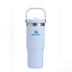 a white and blue stainless steel travel mug with the word stanley on it's side