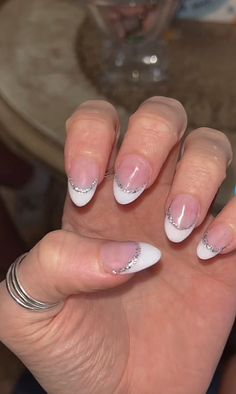 Short Oval French Tip Nails With Design, 2 Layer French Tip Nails, Rounded French Tip Nails With Design, Rounded French Tip Nails With Glitter, Glitter And White French Tip Nails, Short Fresh Tip Nails, White And Sparkle French Tip, Sparkly White French Tip Nails Almond, White French Tip Nails With Glitter Almond