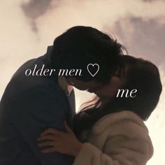 a man and woman kissing in front of the sky with an olden men love me message