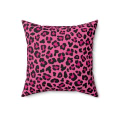 a pink and black leopard print pillow on a white background