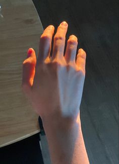 a person holding their hand up in the air