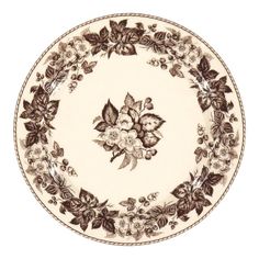 a brown and white plate with flowers on it