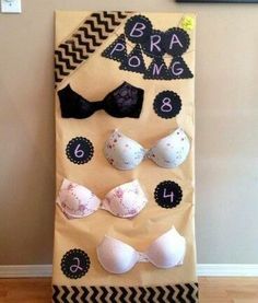 a bulletin board with bras on it in front of a wall and a door