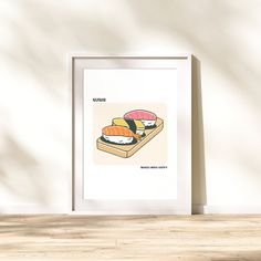 a poster with sushi on it in front of a white wall and wooden floor