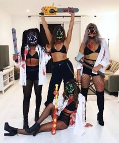 four women dressed up in costumes posing for the camera