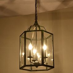 a chandelier hanging from the ceiling in a room