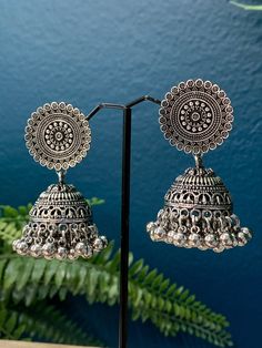 Light weight oversize earring. About 3 inch in length and two inch wide . Push back . Paper light weight . Silver Dangle Jhumkas For Festival, Silver Jhumkas For Festival, Silver Earrings With Bells For Festivals, Silver Bell Earrings For Festivals, Silver Dangle Earrings With Bells, Elegant Silver Jhumkas For Festival, Metal Jhumkas For Pierced Ears For Festival, Metal Jhumkas For Festival, Pierced Ears, Heavy Silver Bohemian Earrings