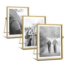 three black and white photos are hanging on a gold frame, with the image of two people holding hands