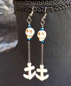 Jewelry fit for a sultry sea siren or a salty sea wench. Made with iridescent glass beads in deep blue oceanic hues and howlite skulls and anchors complemented with antiqued silver chain. Earrings are approximately 3 inches long. Earrings come with your choice of standard ear hook for pierced ears or Clip-on closures for non-pierced ears.  Both are hypoallergenic nickel-free metal alloy.  Please note the example image as a reference to the standard hook and clip on shapes only.  The finish of th Sea Siren, Silver Chain Earrings, Ren Fair, Pirate Skull, Deep Ocean, Ear Hook, Chain Earrings, Blue Beads, Ocean Blue