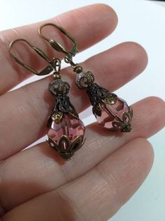 Victorian Burgundy bronze earrings Edwardian earrings bronze earrings Boho Earrings Bohemian earrings antique earrings Filigree drop earring Beautiful Victorian filigree antique style bronze and Burgundy glass beads earrings . Drop earrings . Dangle earrings . Boho earrings . Bohemian earrings . Burgundy  glass beads and  bronze fine ornaments  Boho earrings . Vintage style earrings . Filigree earrings .   We have a same style jewelry set with necklace, shown on the last pictures. FREE SHIPPING  Material :  bronze ornaments beads, glass beads,  Length with hooks : 2.20 ( 5,5 cm) If you have any question, please contact me ! Thank you for visiting my shop ! If you have a RUSH ORDER and you want to pay for FAST SHIPPING by DHL - 3-5 business days is HERE :  https://www.etsy.com/listing/91480 Antique Brass Drop Plug Earrings, Antique Brass Plug Drop Earrings, Victorian Bronze Pierced Earrings, Victorian Style Bronze Pierced Earrings, Antique Gold Victorian Brass Earrings, Victorian Antique Gold Brass Earrings, Antique Gold Copper Earrings With Antique Finish, Antique Gold Drop Earrings With Antique Finish, Antique Drop Earrings With Antique Finish