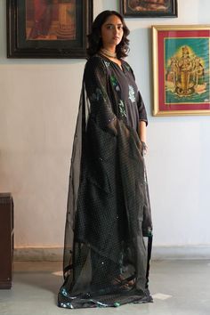 Black hand woven cotton anarkali with floral sequins, applique embroidery. Paired with pant and printed dupatta.
Components: 3
Pattern: Embroidered
Type Of Work: Floral
Neckline: Notched
Sleeve Type: Three quarter
Fabric: Mangalgiri cotton 
Color: Black
Other Details: 
Embroidery detailing on dupatta
Length:
Anarkali: 46 inches
Pant: 38 inches
Approx. product weight: 1-3 kg
Model height: 5ft 7inches, wearing size M
Occasion: Sangeet - Aza Fashions Festive Cotton Palazzo Set With Sheer Dupatta, Black Semi-stitched Palazzo Set With Mirror Work, Cotton Sharara With Sheer Dupatta For Festivals, Cotton Sharara With Sheer Dupatta For Eid, Black Sharara With Chikankari Embroidery For Diwali, Traditional Cotton Kurta With Sheer Dupatta, Festive Black Chanderi Salwar Kameez, Black Georgette Straight Kurta, Designer Cotton Palazzo Set With Sheer Dupatta