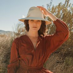 Hand-woven from Paja Toquilla straw and artisan-crafted in Ecuador, this natural straw fedora features a broad brim and an oversized grosgrain band, wrapped asymmetrically around the hat and finished with a modern angular fold. Uv Protection Clothing, Female Owned Business, The Fine Print, Straw Fedora, Air Supply, Fine Print, Artisan Craft, Straw Hat, Ecuador