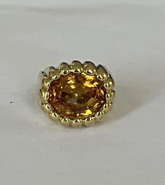 Signet ring in gadrooned yellow gold (18k) holding an oval-cut citrine. Italian work. Eagle head hallmark. Dimensions of the citrine: 12 x 9 mm. Tray: 18 x 15 mm. Height: 9mm. Hallmarks 750 and 18K. Gross Weight: 13.88 g. Size: 49 Possibility of sizing, contact us. Further information : We issue an invoice as well as a certificate of authenticity established by our qualified gemologist (LFG Paris). Our photos are not reworked and are taken in a natural light environment. We can send you a short Gold Oval Topaz Ring Stamped 14k, Formal Oval Yellow Topaz Ring, Formal Yellow Oval Topaz Ring, Oval Gold Topaz Ring With Polished Finish, Yellow Oval Topaz Ring With Polished Finish, Oval Yellow Topaz Ring With Polished Finish, Oval Yellow Sapphire Topaz Ring For Formal Occasions, Yellow Oval Topaz Ring Hallmarked, Oval Gold Topaz Ring Stamped 14k