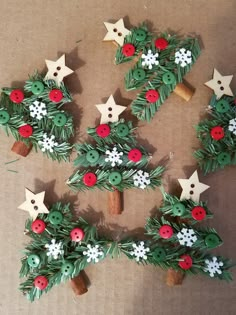 the christmas tree is made out of paper and decorated with red, white and green decorations