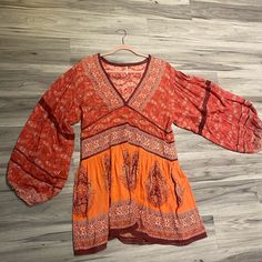 Free People Dress Never Worn Red Short Sleeve Tunic For Spring, Casual Red Long Sleeve Tunic, Bohemian Red V-neck Mini Dress, Red Bohemian V-neck Mini Dress, Casual Red V-neck Boho Dress, Bohemian Long Sleeve Red Dress, Bohemian Red Long Sleeve Dress, Fall Rayon Boho Dress With V-neck, Fall V-neck Boho Dress In Rayon