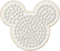 a mickey mouse head with pearls on it