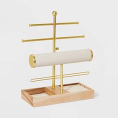 a wooden stand with two rolls of paper on it