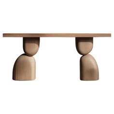 the wooden table is made from wood and has two small round bases on each end