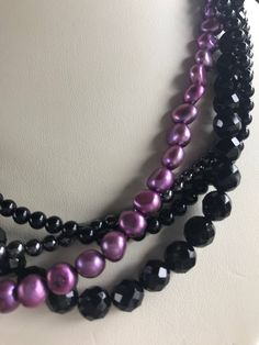 "This is an absolutely stunning black onyx and purple pearl multi strand necklace. It is marked 585 (14k) on the clasp. I believe it's French. The beads are faceted and smooth. They are 4mm and 8mm. The pearls are 8mm. There are 4 strands. The necklace measures 17\" long. It about 7/8\" wide when flat. This necklace is in excellent Pre Owned Estate condition. I believe it was never worn. INTERNATIONAL BUYERS- This item will only be shipped via Priority International Mail Insured. It is the buyer Formal Multi-strand Black Beaded Necklaces, Formal Multi-strand Black Beaded Necklace, Formal Black Multi-strand Beaded Necklaces, Formal Black Multi-strand Beaded Necklace, Elegant Multi-strand Purple Beaded Necklaces, Elegant Purple Multi-strand Beaded Necklaces, Purple Pearl, Onyx Bead, Vintage Purple