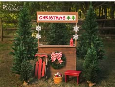 a christmas tree stand with wreaths and decorations