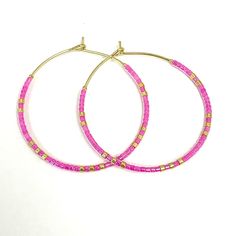 Caryn Lawn Baja Hoop Earrings in Pink. Pink Hoop Earrings With Tiny Beads As Gift, Pink Hoop Earrings With Tiny Beads For Gift, Trendy Hoop Jewelry For Jewelry Making, Beaded 14k Gold Filled Hoop Earrings, Gold Hoop Earrings With Colorful Beads For Everyday, Adjustable Pink Hoop Earrings, Pink Hoop Earrings With Colorful Beads, Trendy Nickel-free Beaded Hoop Earrings, Everyday Gold Hoop Earrings With Colorful Beads