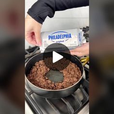 a person is cooking food in a pan on the stove with an ice cream bar