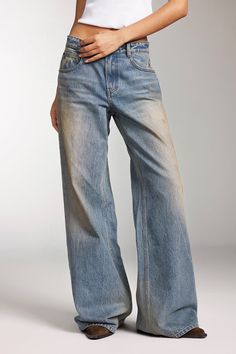 Selected pure cotton denim, made from Turkish cotton with long, glossy fibers, results in a fabric that is more skin-friendly and comfortable. The fabric has a rugged texture with prominent slub yarns in both the warp and weft. Through multiple washing and processing techniques such as enzyme washing, hand sanding, snowflake washing, and stain washing, each piece offers a unique fashionable look, embodying the texture and charm of vintage denim. The jeans feature a precisely tailored curved waistline, with custom buttons and a high-quality zip fly, emphasizing attention to detail and high quality. The brown label has a natural crinkle effect, and the irregular stain washing adds a touch of individuality. The sharp lines and sturdy construction, along with the straight-leg cut, make these j Sand Washed Jeans, Warp And Weft, Denim Texture, Dream Fashion, Boy Fits, Boys Fits, Jumpsuit Jacket, Custom Buttons, Style Jeans