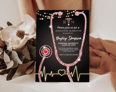 a card with a stethoscope on it next to flowers and a bouquet