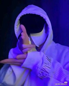 a person in a white hoodie holding their thumb up