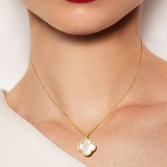 Trending for 2024, designer inspired and perfect for everyday. Beautiful and elegant Crystal accented gold mother of pearl Quatrefoil Pendant necklace. approx 14" - 16" chain extender to adjust to neckline 14K gold plated *Note processing time is not shipping time, our regular Free shipping takes approx. 5-6 days to receive after shipped. With rush processing your order is expedited and you will also be upgraded to priority mail approx 2-3 days to arrive once shippedExpress shipping is available Communion Headpiece, Swarovski Tiara, Crystal Purse, Wedding Necklace Set, Wedding Hair Headband, Bow Necklace, Chain Extenders, Bridal Bracelet, Tiaras And Crowns