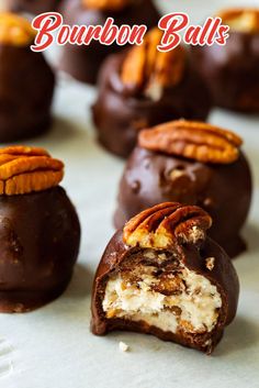 chocolate covered candies with pecans and nuts on top