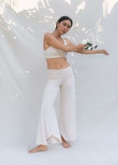 Inspired by the moving and evolving body, giving you comfort and effortless style no matter the stage of your female form. We bring to you, our cherished Layla Flares, made sustainably with love and the intention for all bodies to simply be. Perfect for Yin, Meditation, flowy movement and your everyday comfort. Moulds to the unique contours of your body, feeling like a soft second skin. Soft & stretchy plant viscose is a favourite for new and expecting mums. Gradually Flared for a flowing silhou Flowy Yoga Clothes, Moisture-wicking White Activewear For Yoga, White Full-length Yoga Bottoms, Blue Wide-leg Yoga Bottoms, Organic Yoga Clothes, White Flare Pants, Flattering Pants, White Flares, Flowy Pants