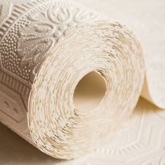 a roll of white paper sitting on top of a table