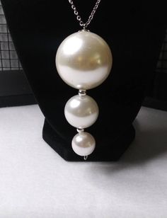 White Dangle Costume Jewelry, Costume Jewelry Round Pendant For Party, Silver Dangle Jewelry With Large Beads, Metal Jewelry With Large Beads For Gift, White Round Necklaces With Matching Earrings, Metal Jewelry With Large Beads As Gift, White Pendant Jewelry With Matching Earrings, Pearl Party Jewelry With Large Beads, White Pendant Necklace With Matching Earrings