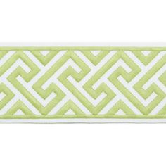 a green and white ribbon with an intricate design